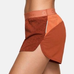 Outdoor Voices Athletic Shorts in Rust and Orange